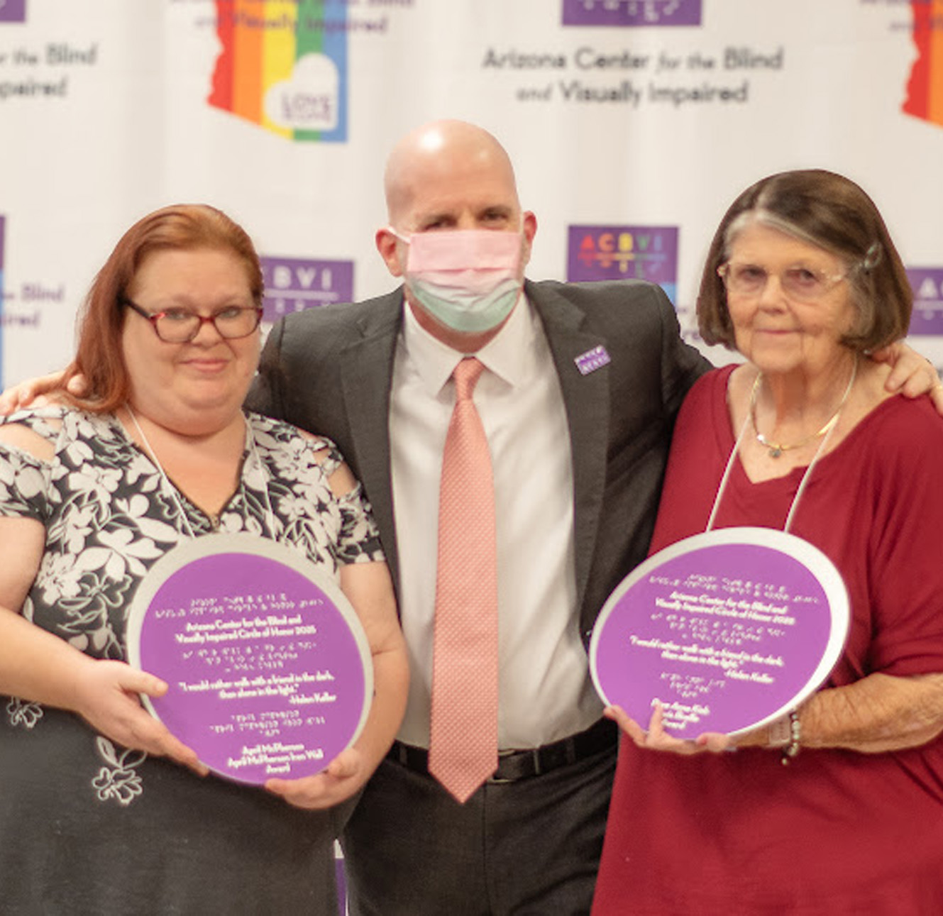Photograph of two Honorees of 2025 ACBVI Circle of Honor Awards along with the presenter
